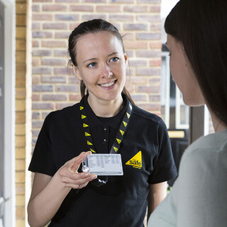 Engineer showing Gas Safe ID card v2